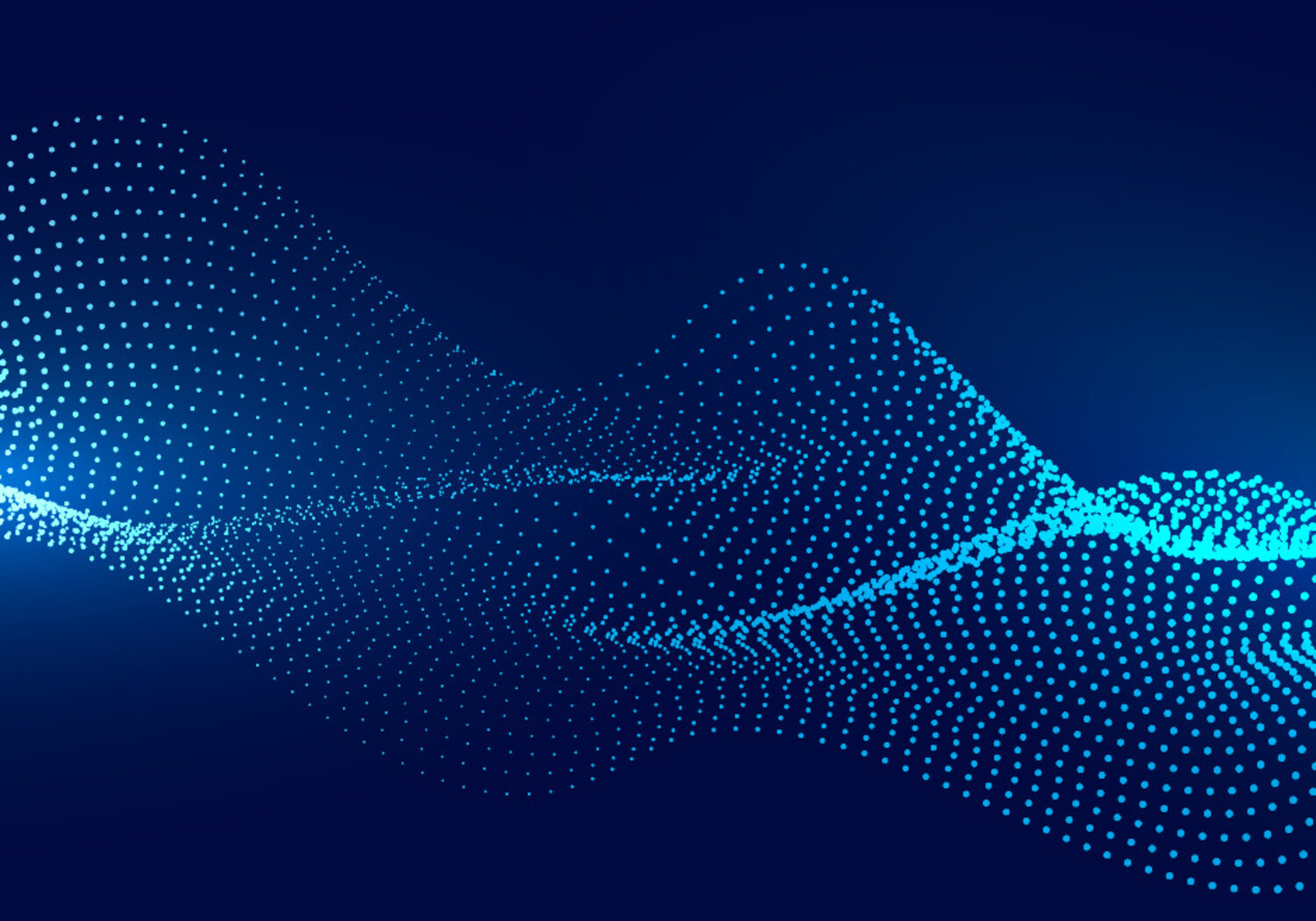 Image showing an artists concept of a particle wave Against a dark blue background is a glowing blue image of a wave composed of small particle of light.