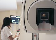 Image showing a Clinician operating a linear accelerator