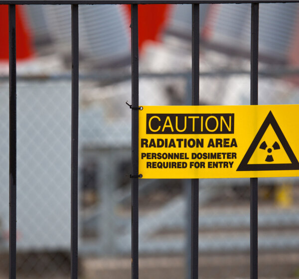 Image showing a radiation warning sign on a gate