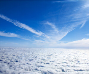 Image showing the view of clouds through the potral of a plane