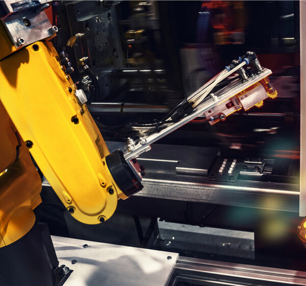 Image of a industrial robotic arm in a factory