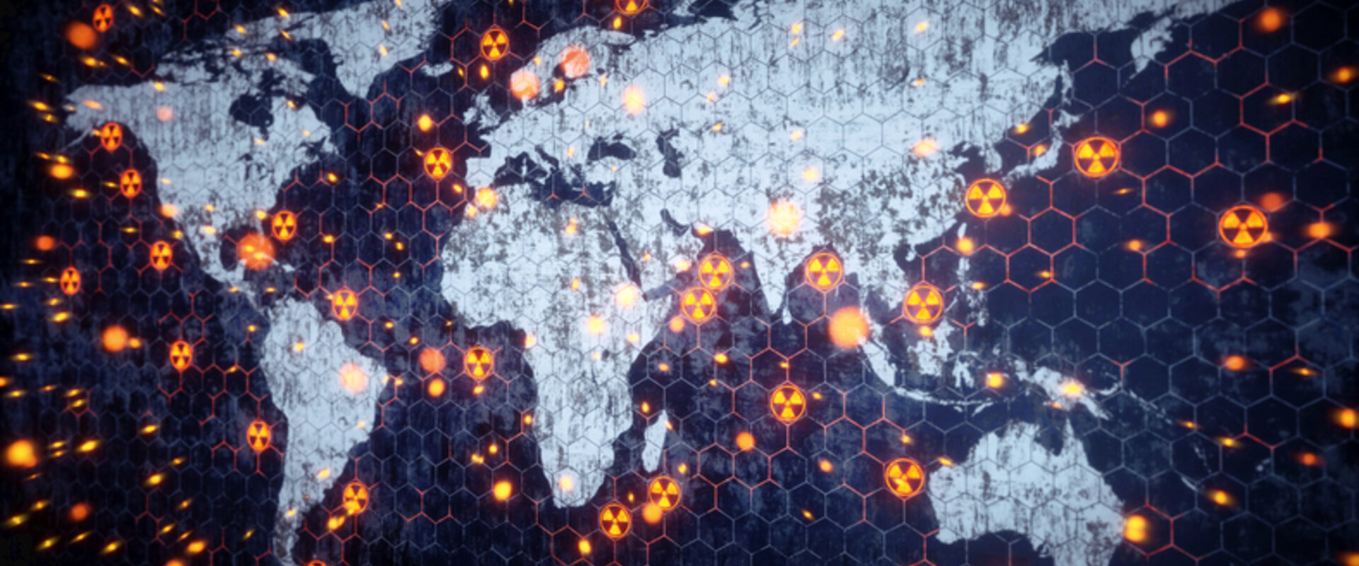 A stylised image of the world with the continents in white and the oceans in deep blue. Dotted around the land and oceans are nuclear hazard symbols representing nuclear explosions or tests