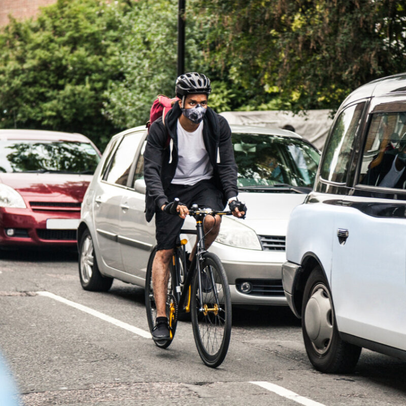 Cyclist commuter wearing a pollution mask