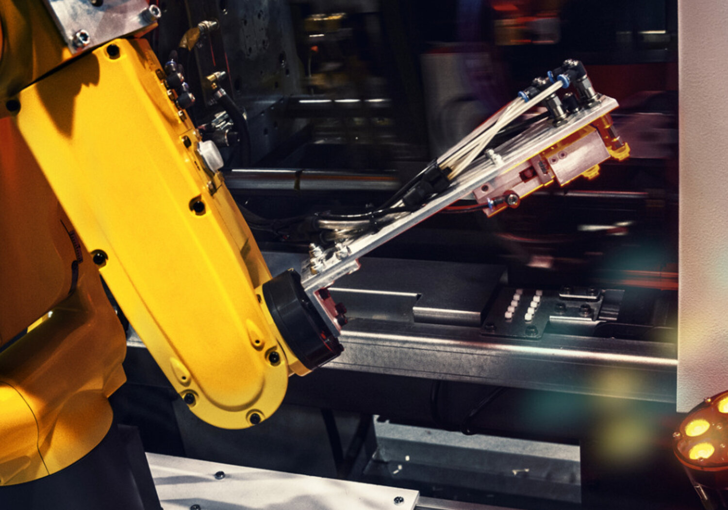 Image of a industrial robotic arm in a factory