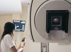 Image showing a Clinician operating a linear accelerator
