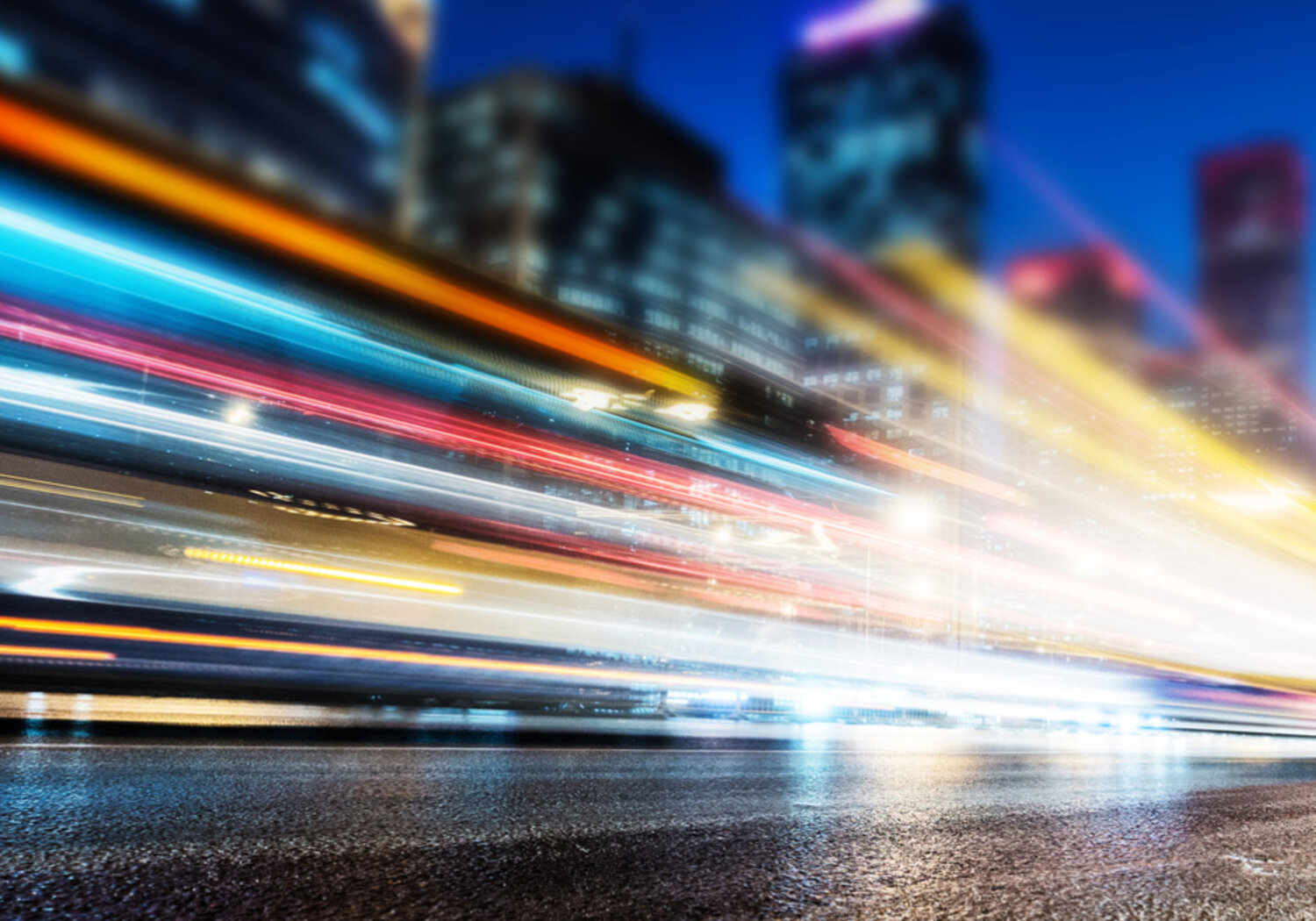 Image of stop-motion streams of light from vehicle headlights at night