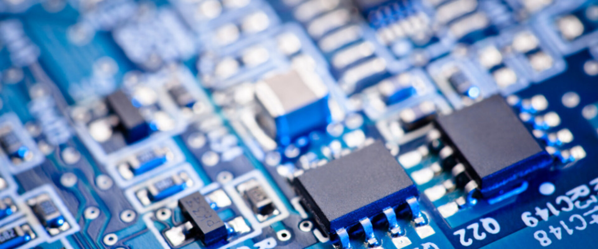 Blue computer circuit board focus set on two microchips picture id154961756