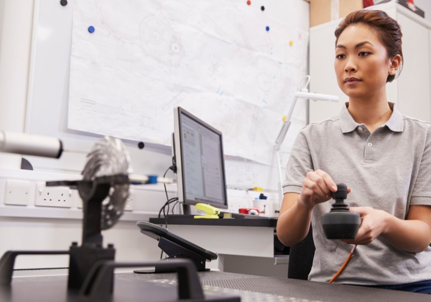 Image showing an engineer using a  Coordinate Measuring Machine (CMM) in factory