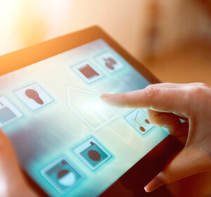 Image showing a smart home control app on a tablet