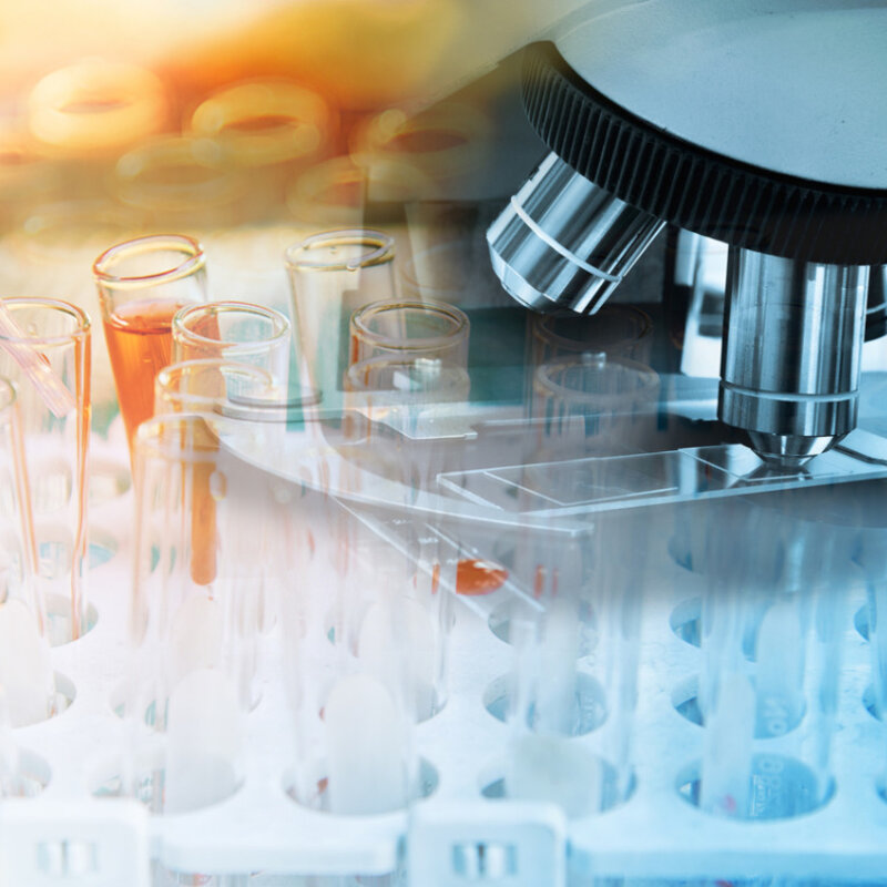 Image of microscope and laboratory glasware