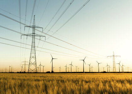 Image showing power lines and wind turbines in autumn sunlight