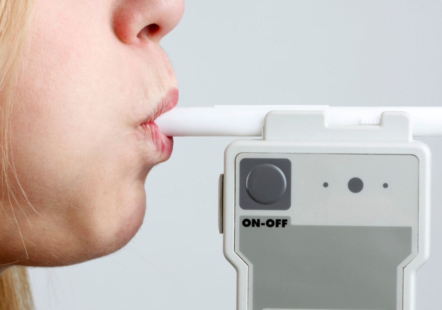 Image showing a person blowing in breathalyser
