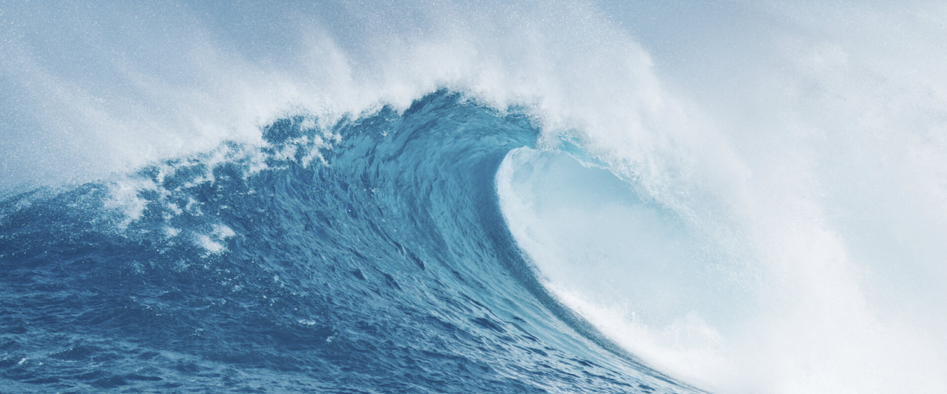 Crashing ocean wave against blue sky in hawaii - Project Picture ENV05